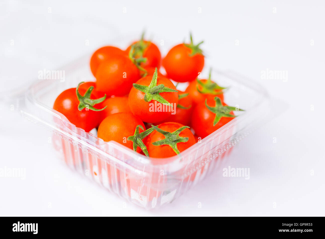 Fresh cherry tomatoes on white background Stock Photo - Alamy