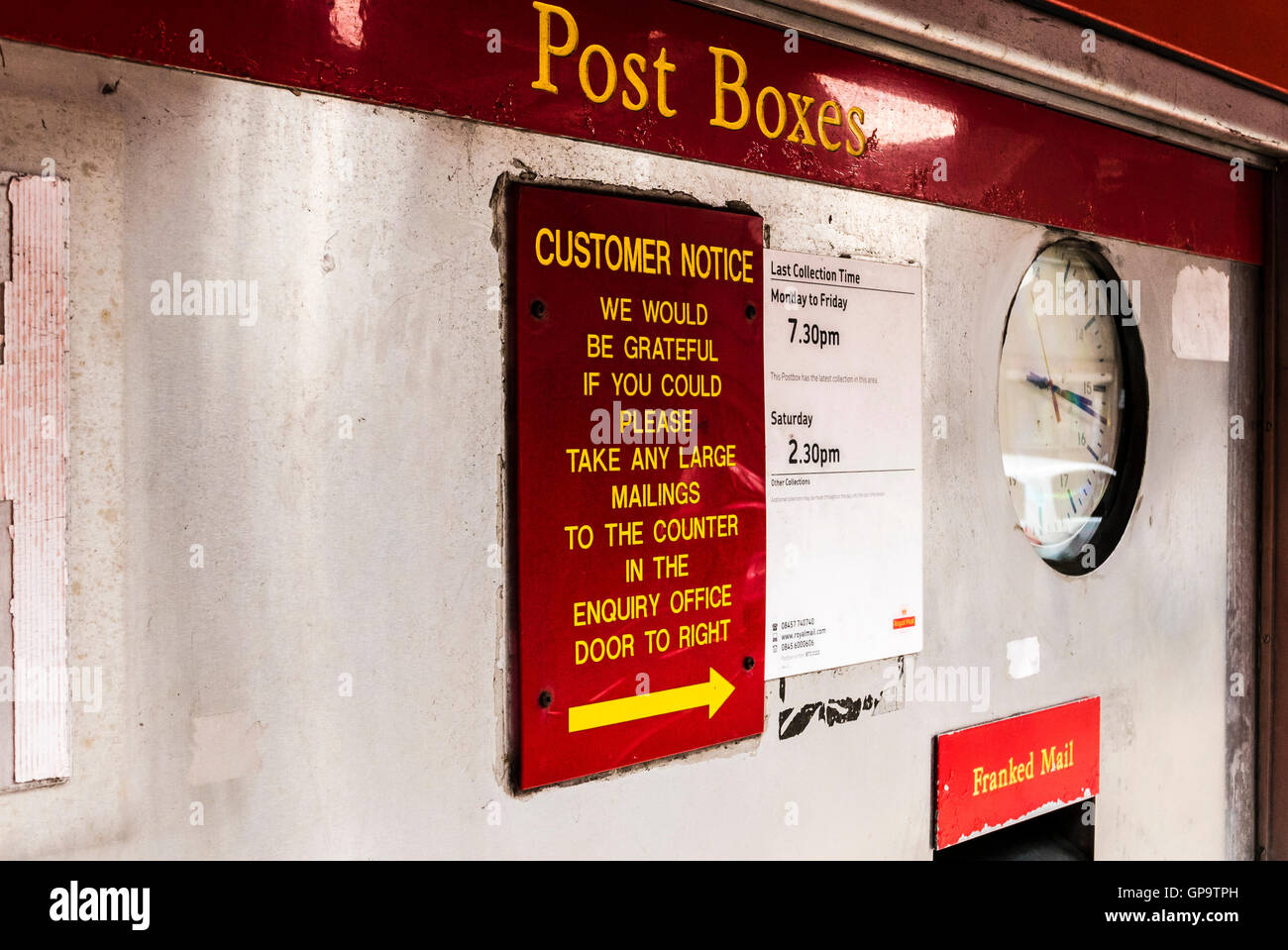 Letter box at a main Royal Mail sorting office, including boxes for franked and stamped post. Stock Photo