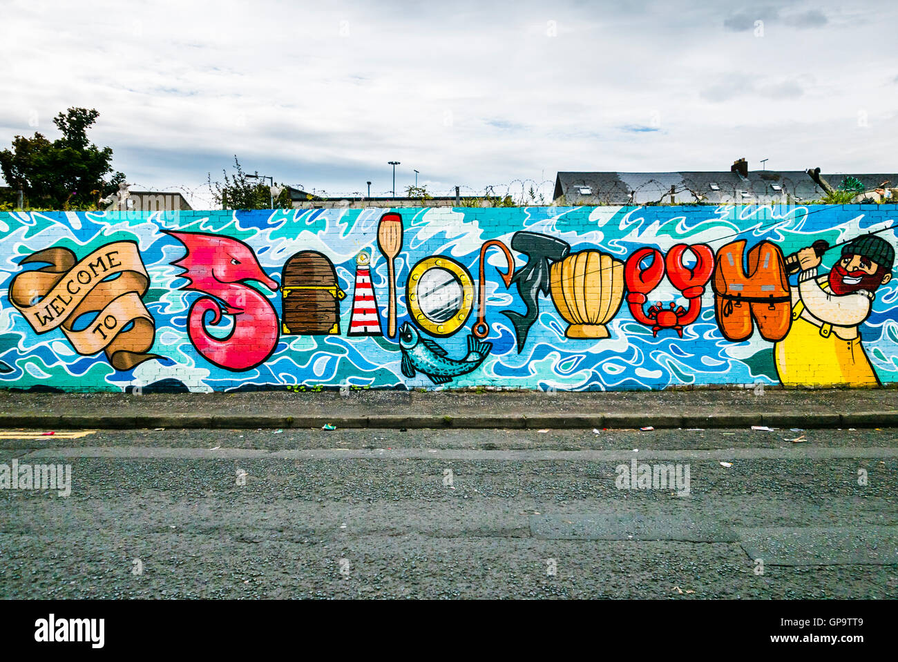 Mural welcoming people to the Sailortown Quarter in Belfast, an old residential area beside the docks. Stock Photo