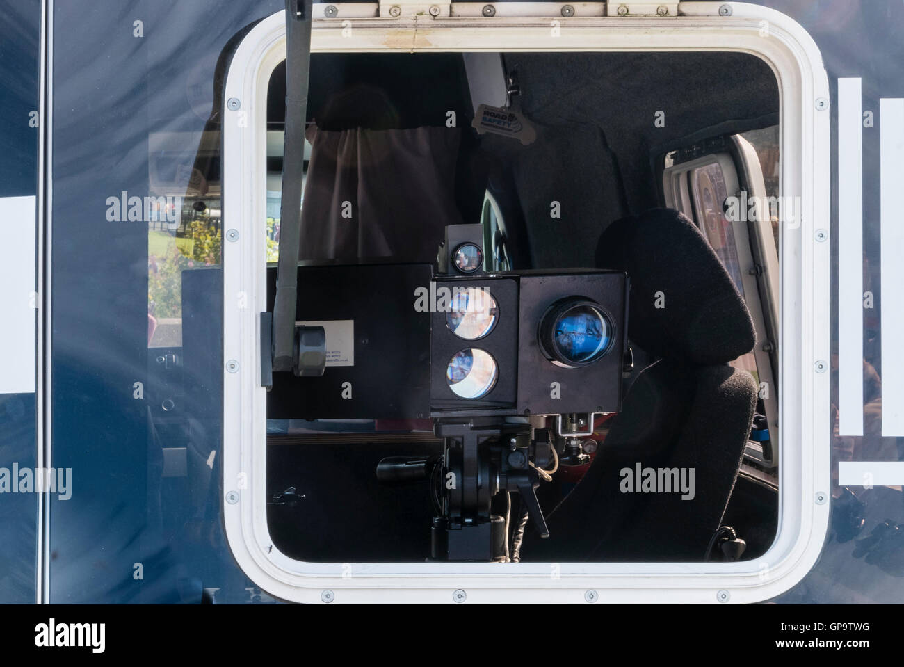 Speed camera detector van with camera looking out rear window. Stock Photo