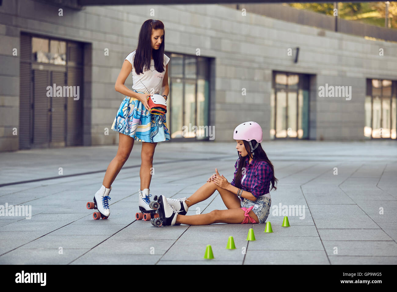 Bruised leg while roller skating girl offer protection for the knees