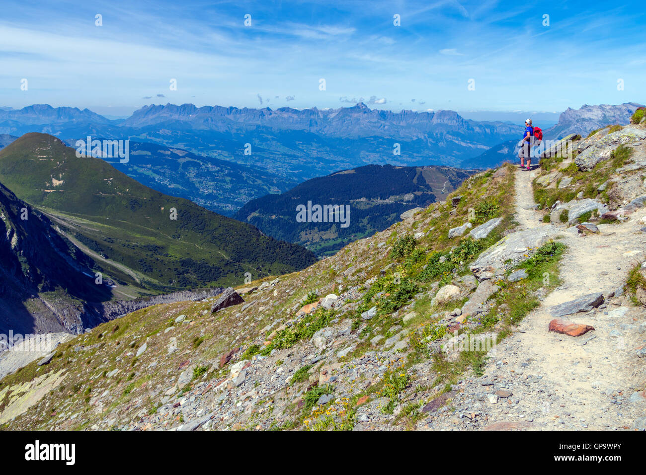 Female hiker takes in the view, Nid d'Aigle, Chamonix, France Stock Photo