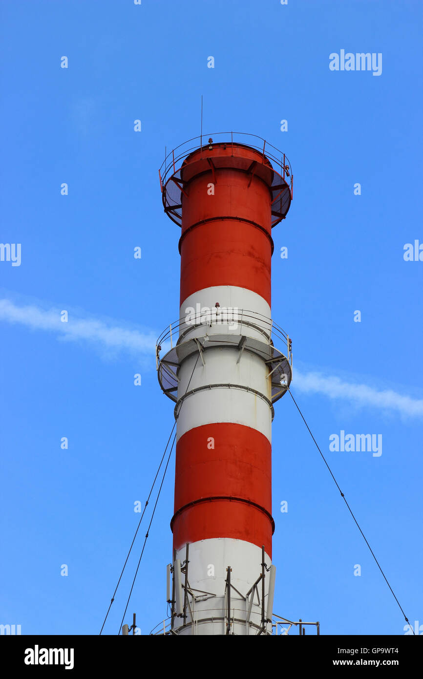 Industrial pollution chimney without a smoke on blue sky background. Concept for environmental protection Stock Photo