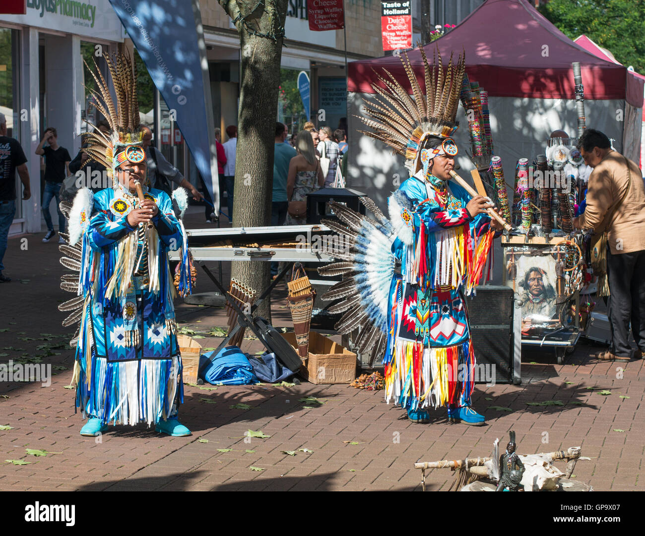South American Indians in traditional dress playing pipes, Carlisle, Cumbria, England, UK Stock Photo
