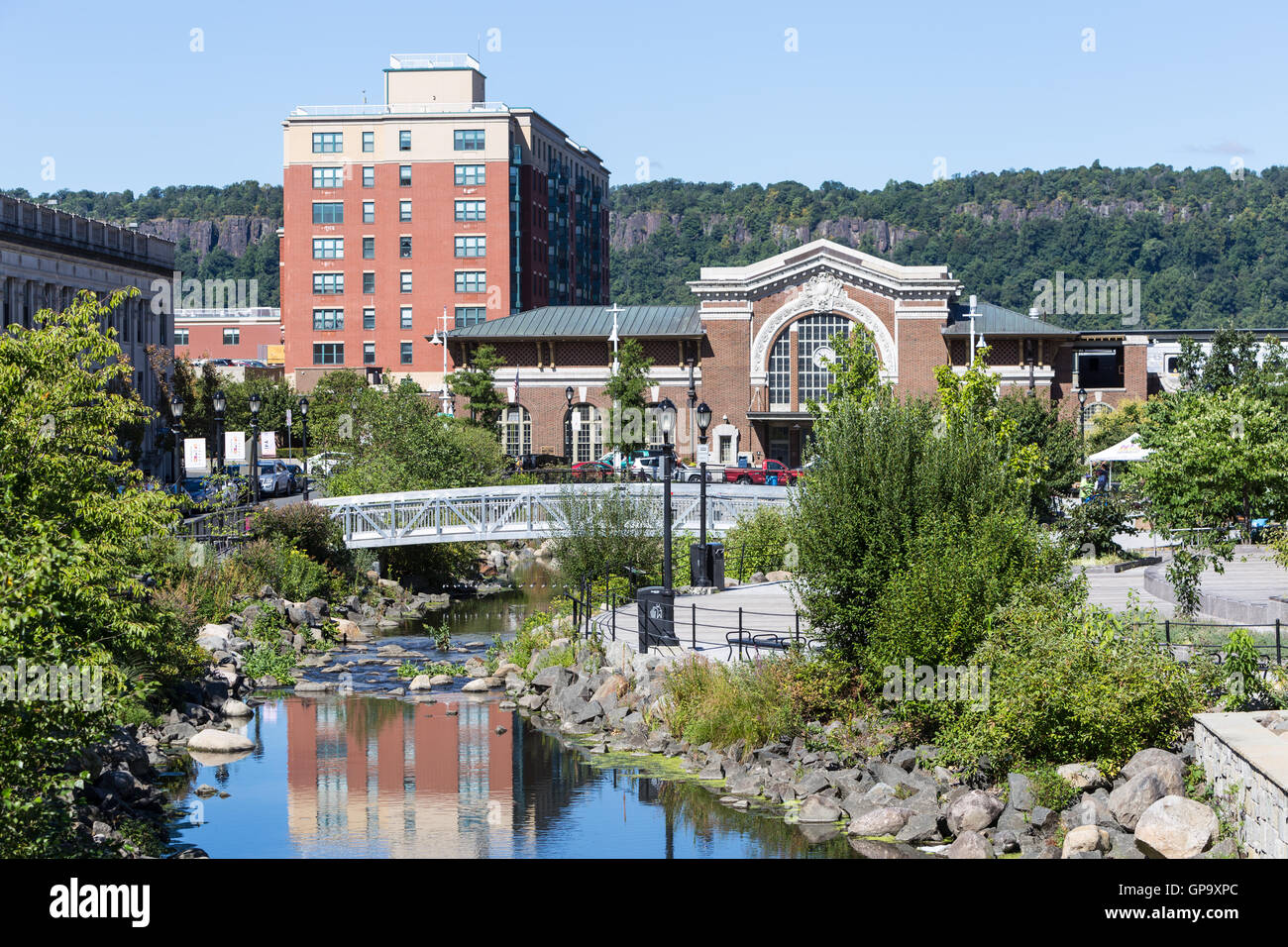 The Saw Mill River in Van Der Donck Park leading to the train station in Yonkers, New York. Stock Photo