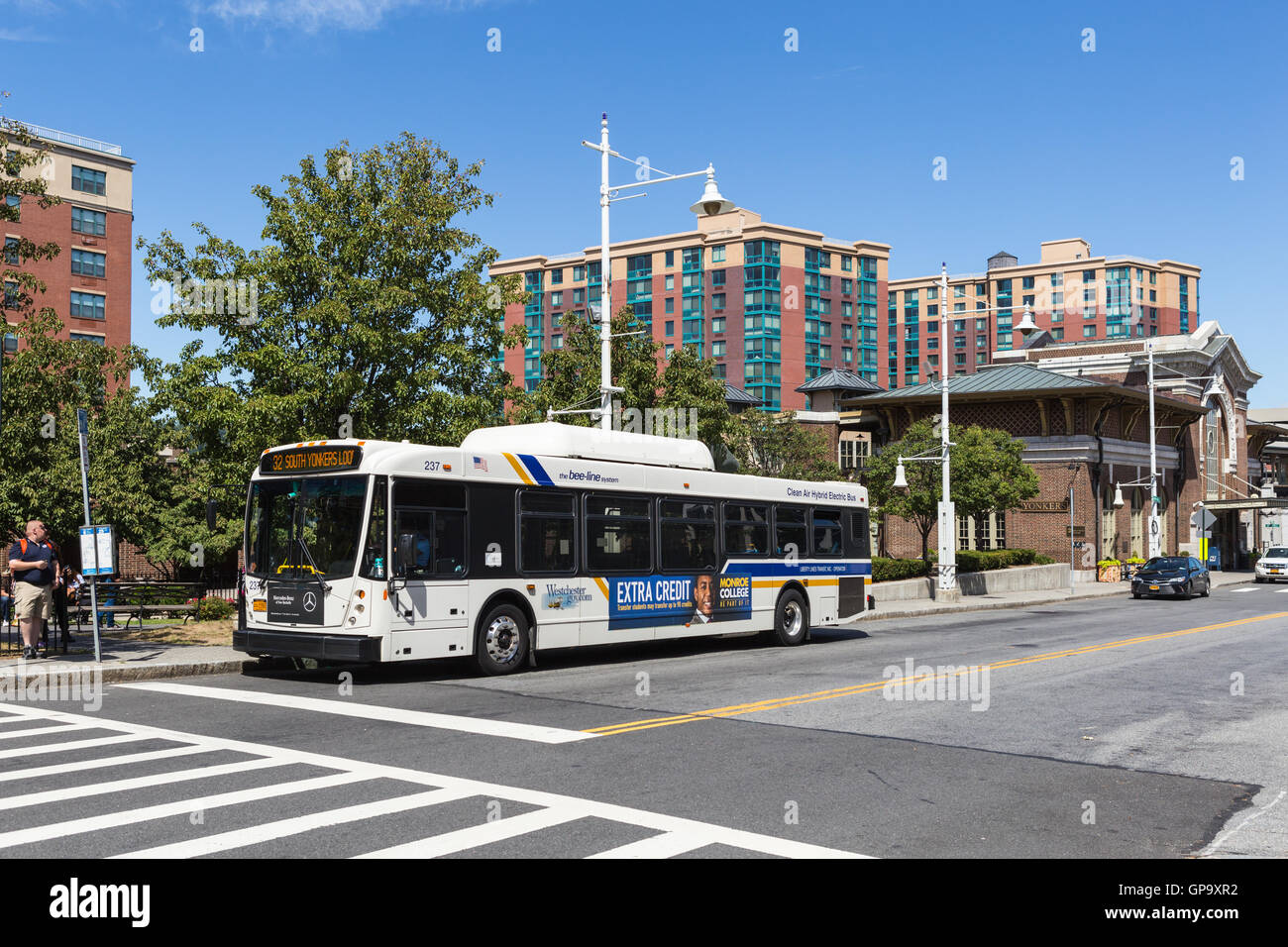 Westchester Bee-line system route 32 Yonkers loop bus waits for passengers outside of the train station in Yonkers, New York. Stock Photo