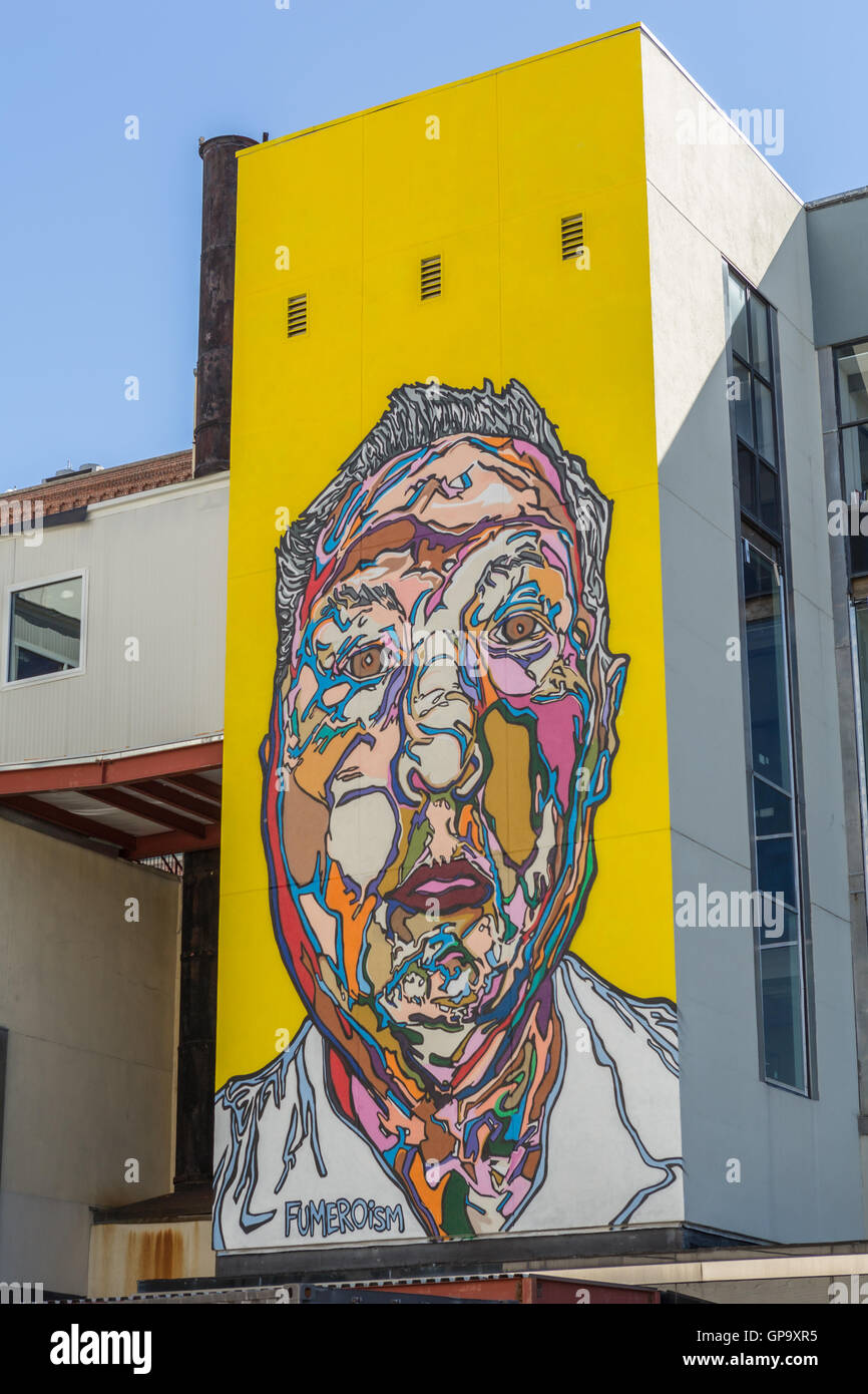 A contemporary wall mural by street artist Fumero on the side of the Herald Statesman building in Yonkers, New York. Stock Photo