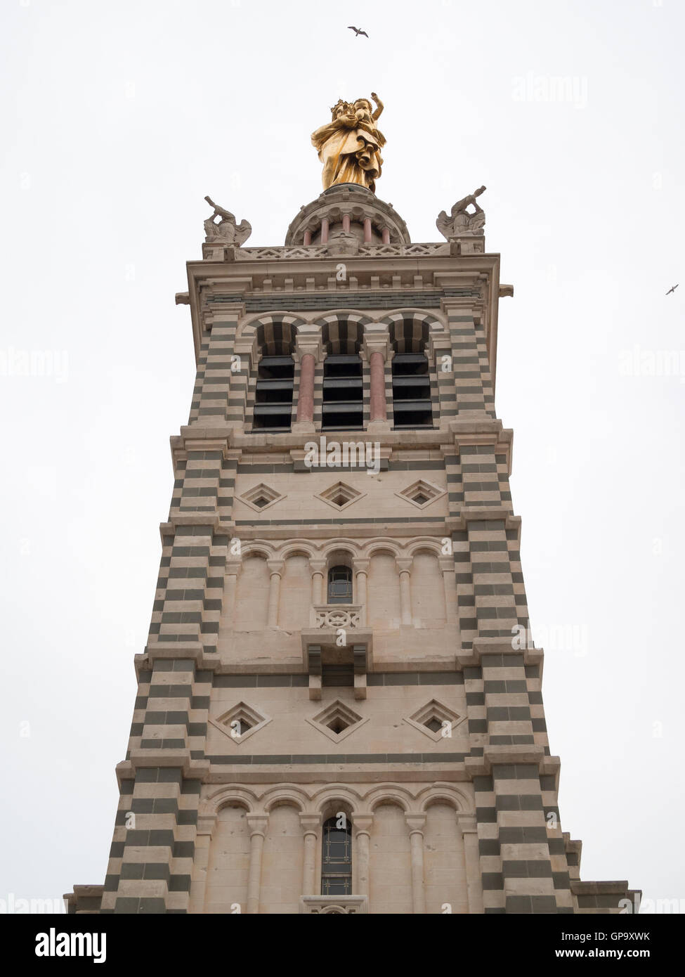 Basilique Notre-Dame de la Garde tower with the golden Virgin and the ...