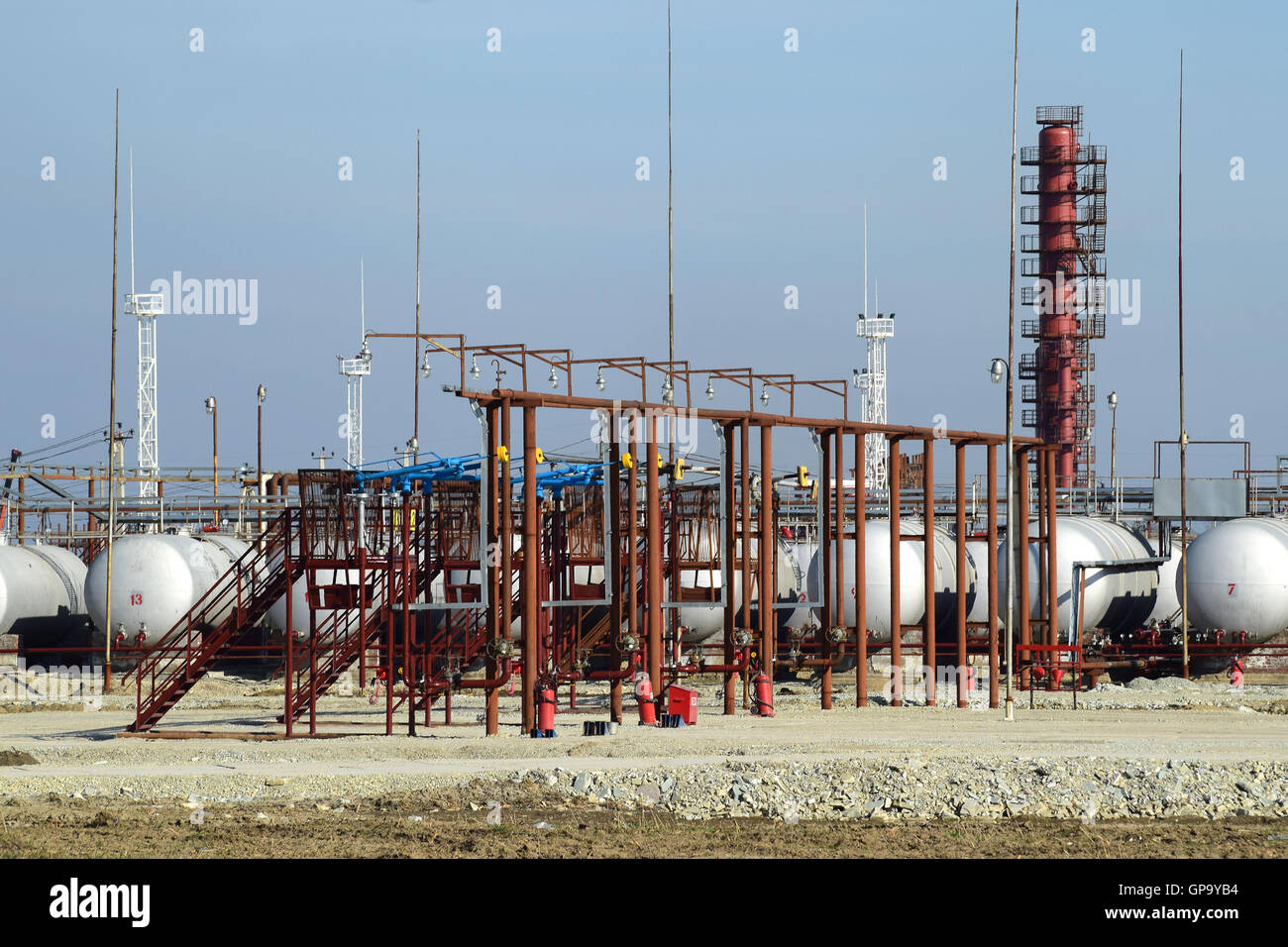 Overpass loading of oil products and fuel storage vessels Stock Photo