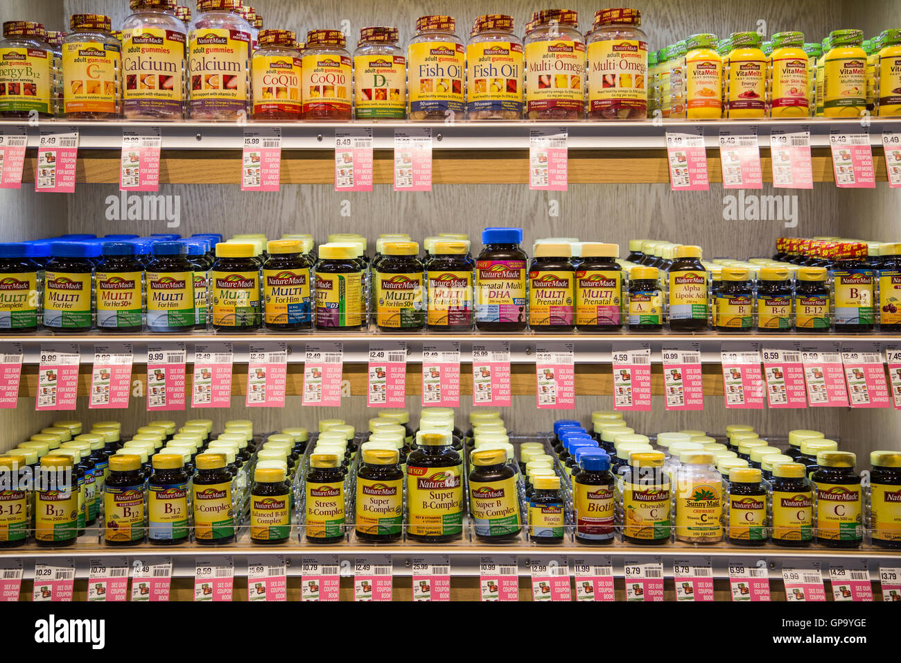 Bottles of vitamins on the shelves of a drug store Stock Photo