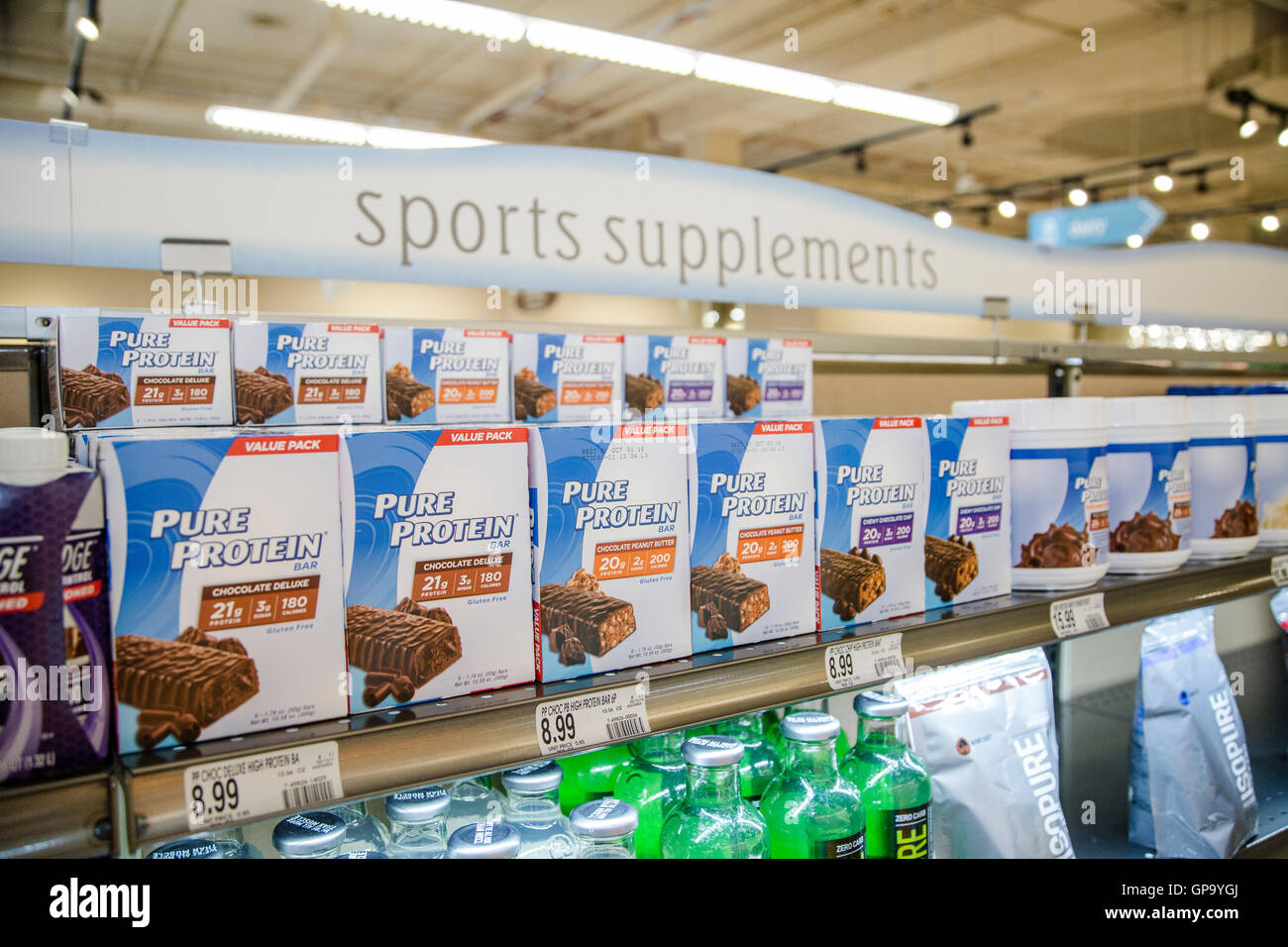 Boxes of Pure Protein brand protein bars in the sports supplements section of a drug store Stock Photo