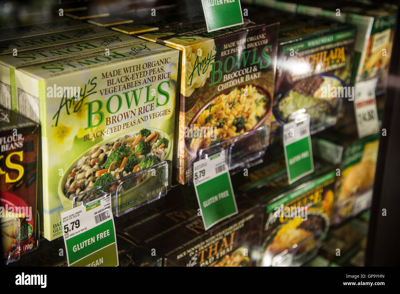 Boxes of Amy's organic meals in the freezer case of a grocery store Stock Photo