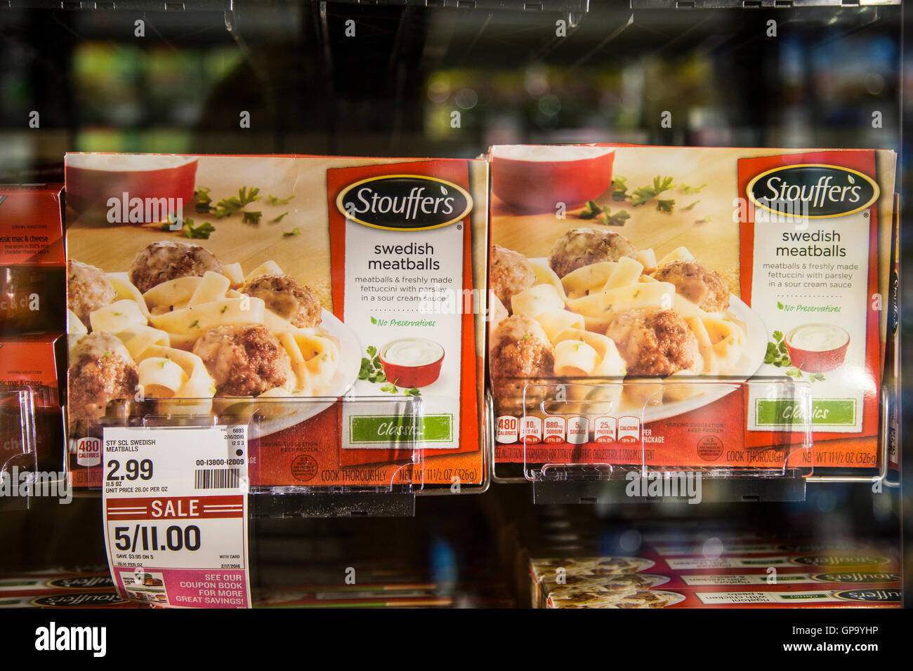 Boxes of Stouffer's brand frozen meals in the freezer case of a grocery store Stock Photo