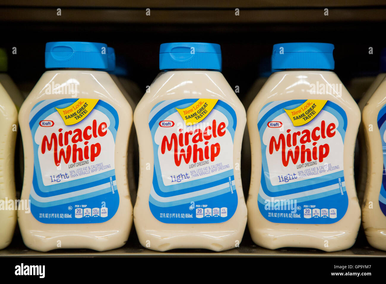 A row of Kraft Miracle Whip squeeze bottles on the self at a grocery store. Stock Photo