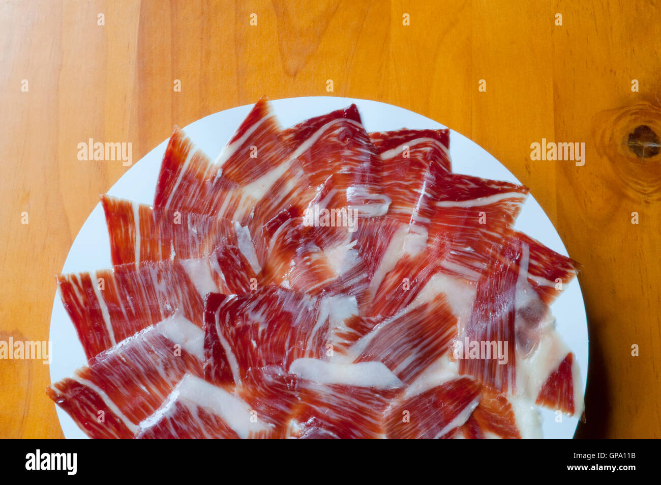 Iberian ham serving. Spain. Stock Photo