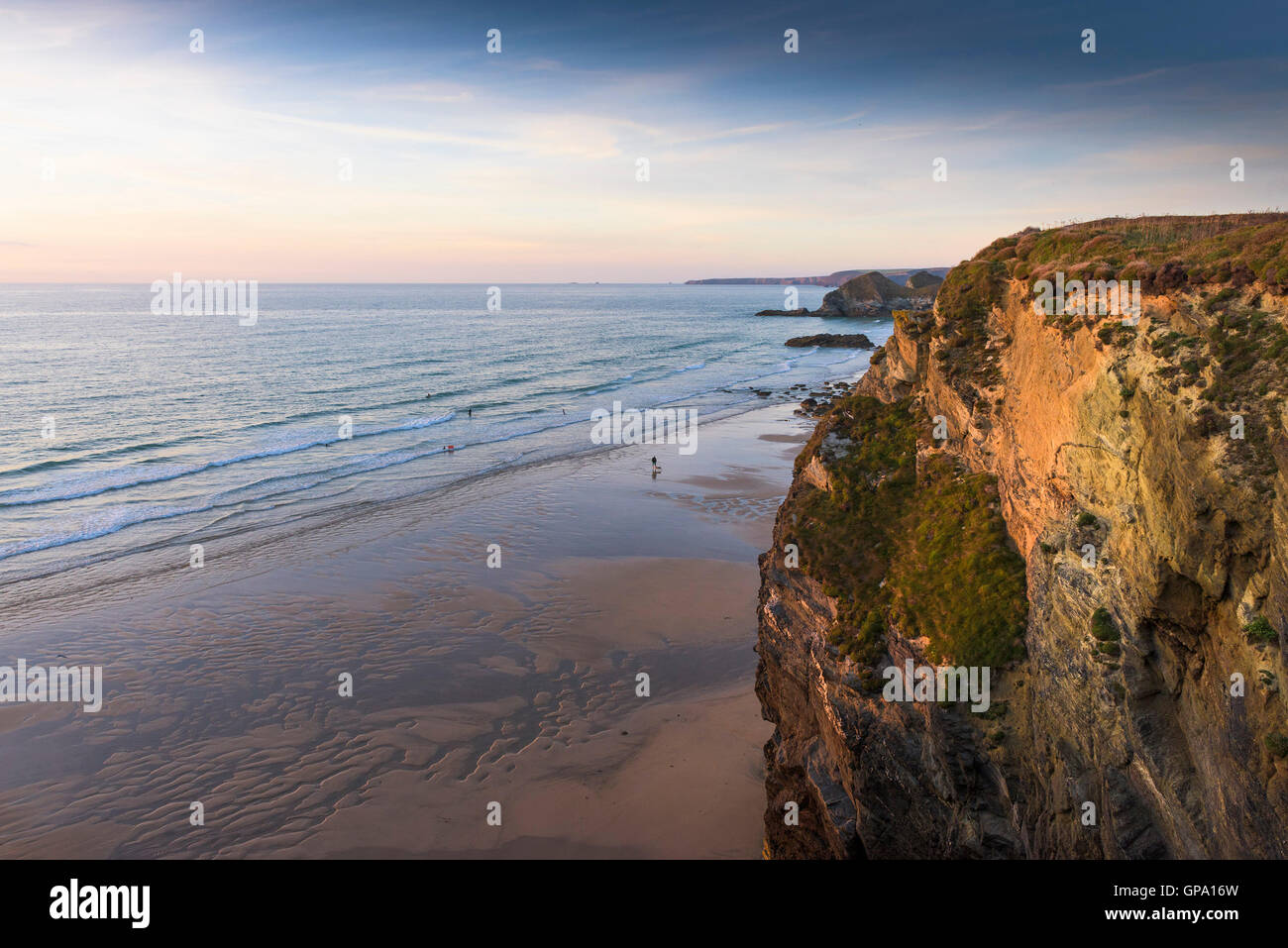 Evening light over Whipsiderry Beach and cliffs in Newquay, Cornwall. Stock Photo