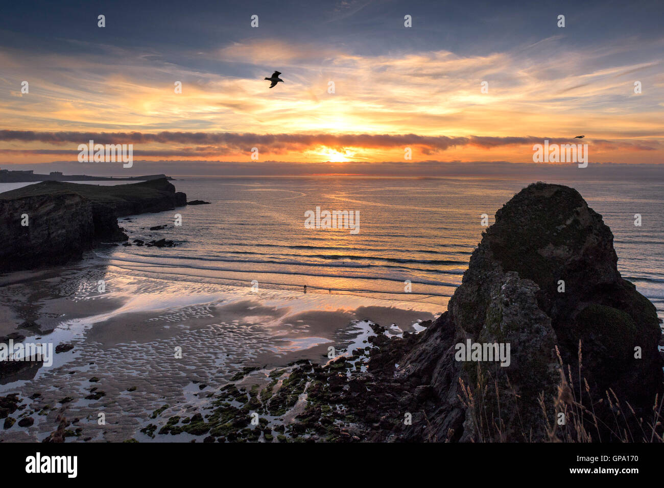A spectacular sunset breaks over Whipsiderry Beach in Newquay, Cornwall. Stock Photo