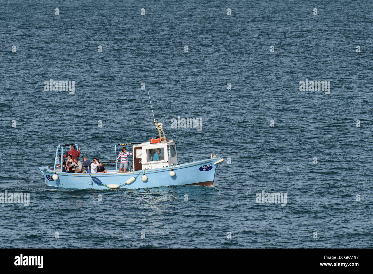 Island Maid, a pleasure boat full of holidaymakers mackerel fishing in Newquay Bay, Cornwall. Stock Photo