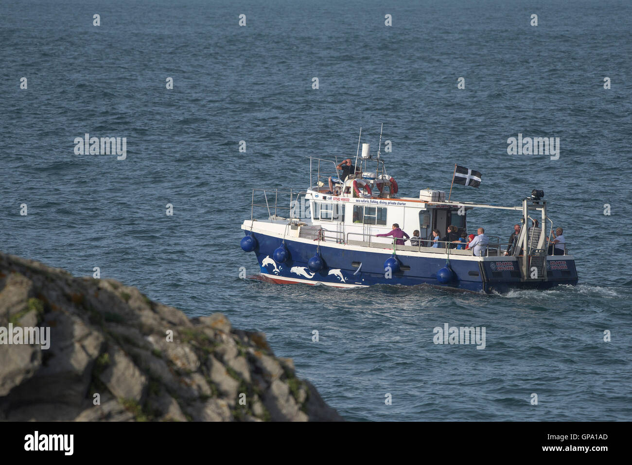 The Atlantic Explorer from Newquay steams around Towan Headland in Cornwall. Stock Photo