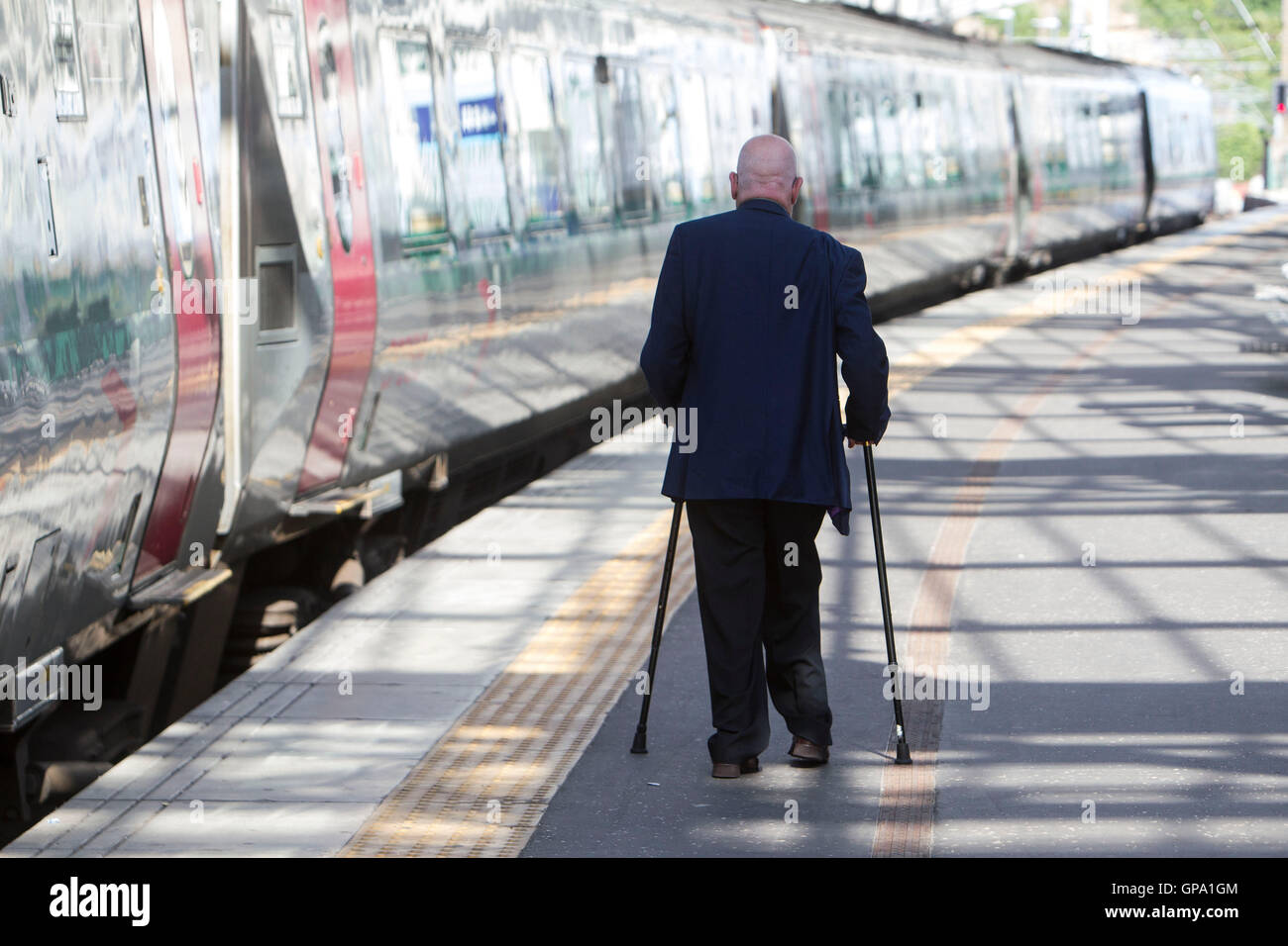Disabled person using public transport Stock Photo