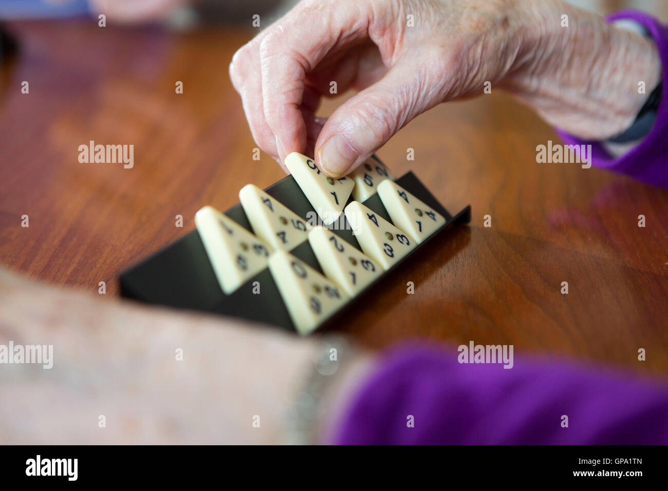 Elderly people keeping mentally active Stock Photo