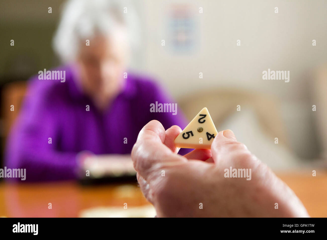 Elderly people keeping mentally active Stock Photo