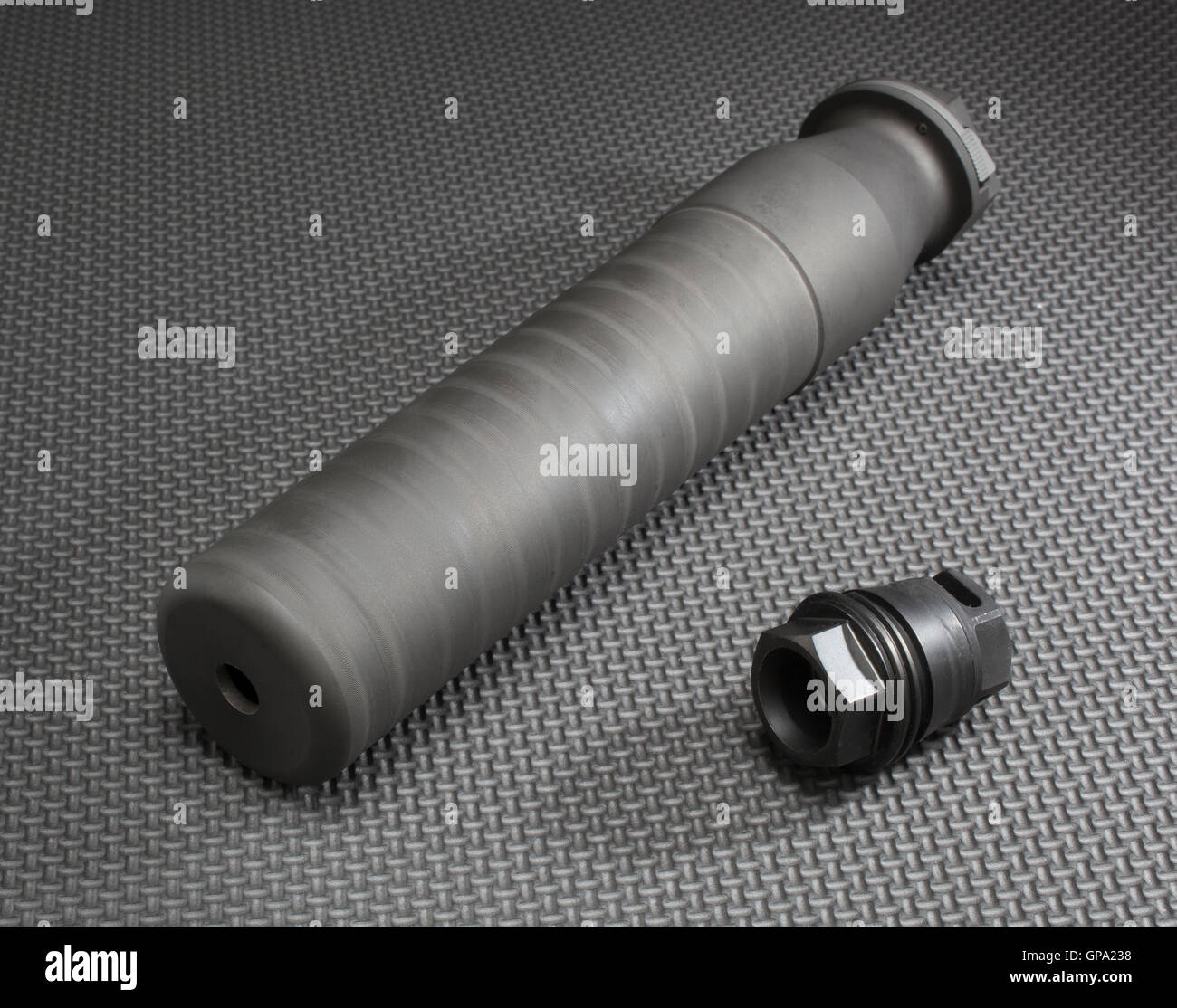 Suppressor and the mount that holds it firmly on a rifle barrel Stock ...