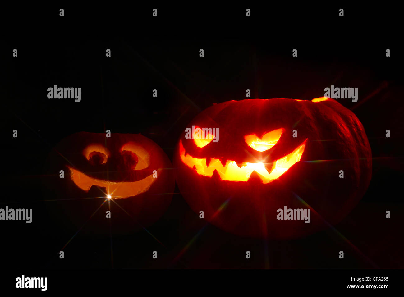 Illuminated cute halloween pumpkin isolated on black background Stock ...