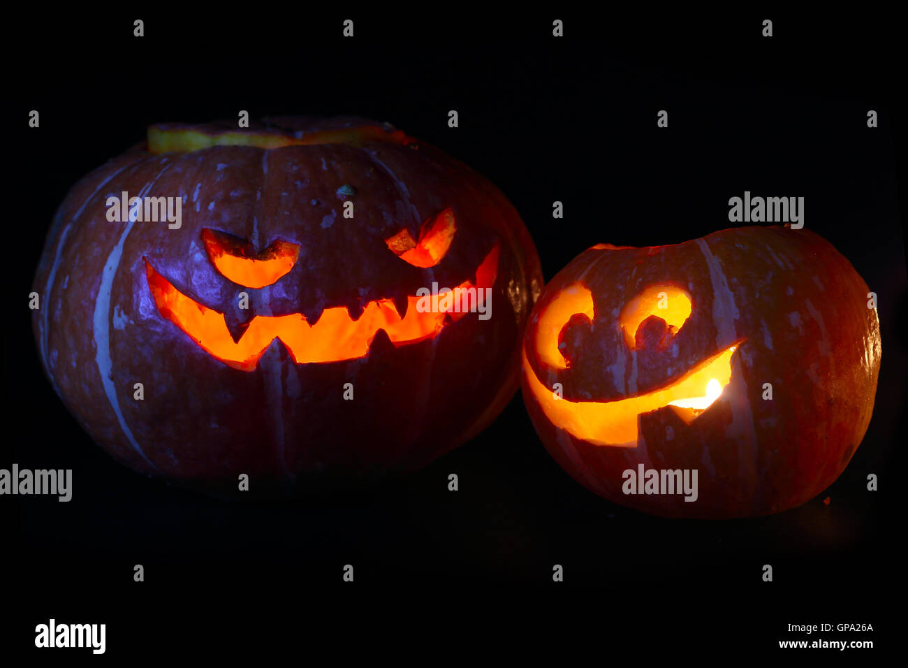 Illuminated cute halloween pumpkin isolated on black background Stock ...