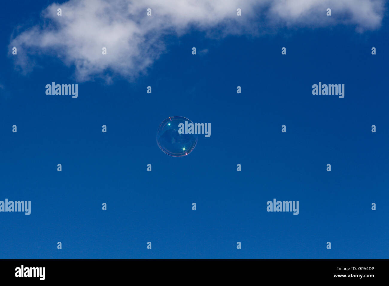 Bubble ascending in the sky. Stock Photo