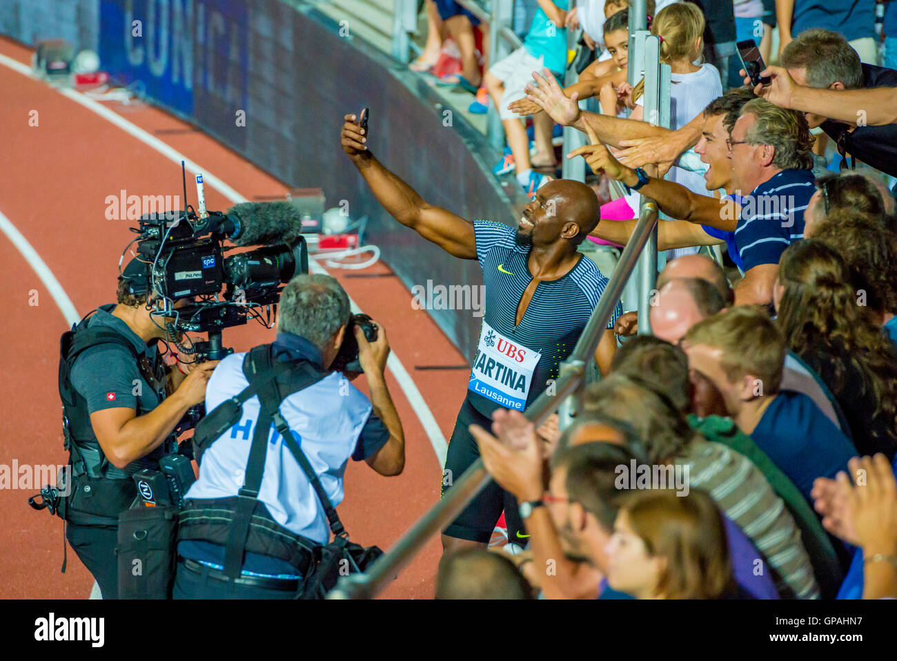 Churandy Martina (NED) gives away a selfie session after his 1st place in the Men's 200m Diamond Race Athlétissima Lausanne Stock Photo