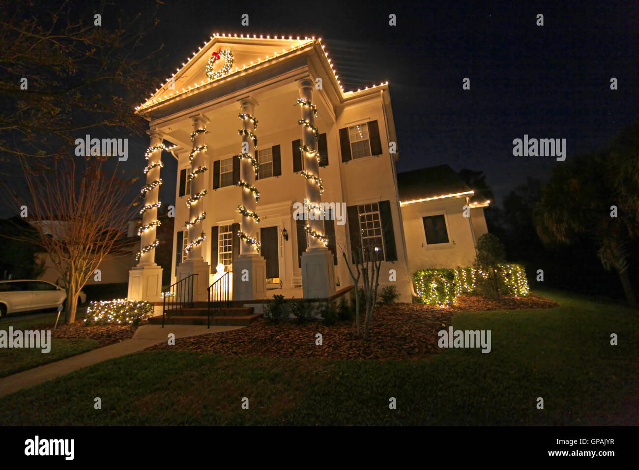 A Colonial House with a lot of Christmas Lights Stock Photo Alamy
