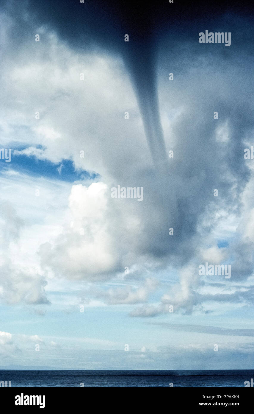 A waterspout develops from storm clouds over the Pacific Ocean off the coast of Southern California, USA. Stock Photo