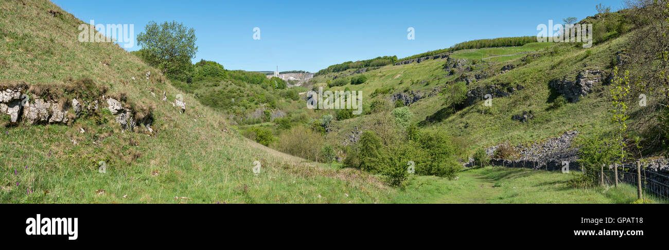 Limestone scenery near Buxton, Derbyshire. VIew to Great rocks dale and the quarry there. Path leading down to the Monsal trail. Stock Photo