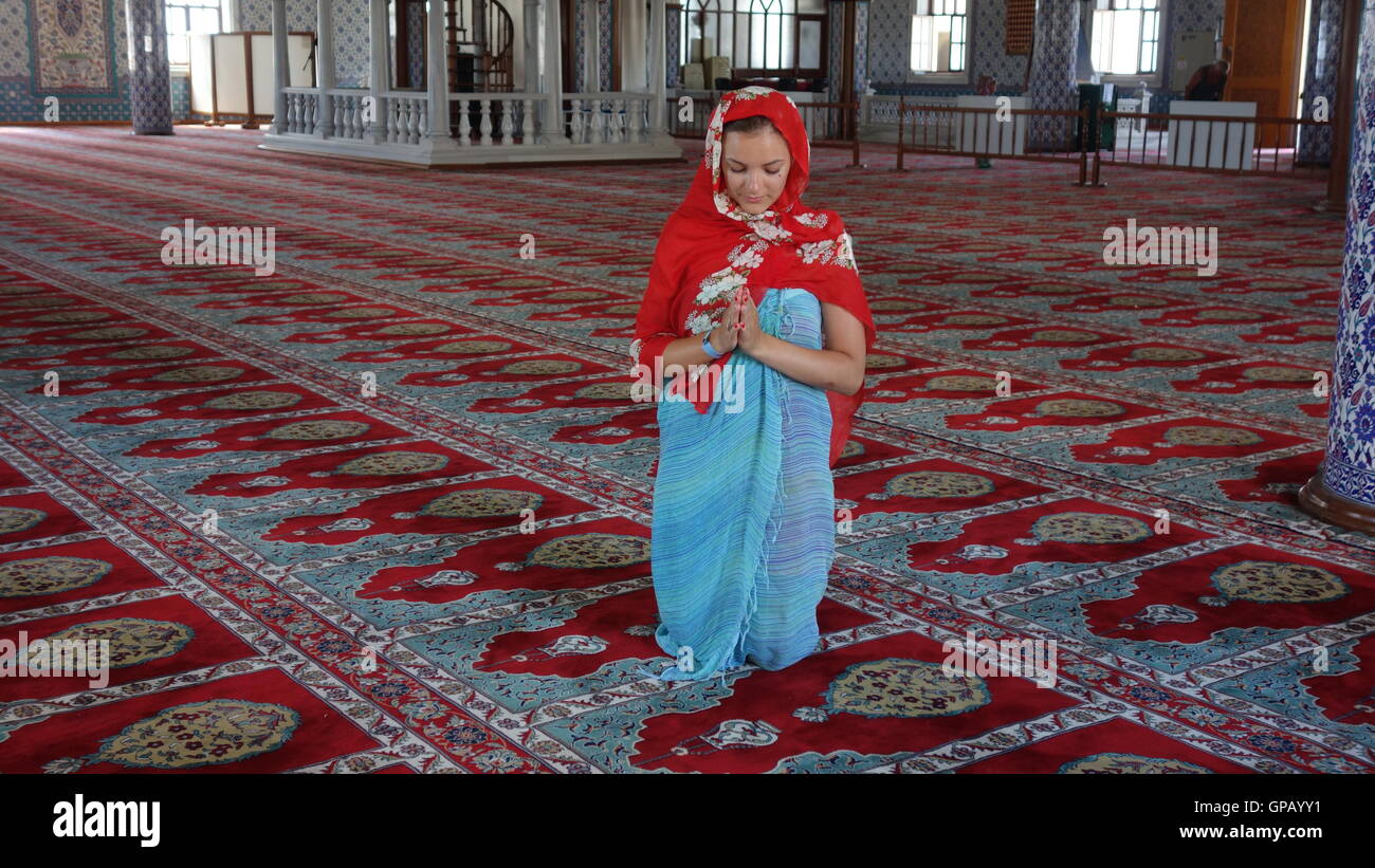 European women praying in a Turkish mosque - Alanya Stock Photo