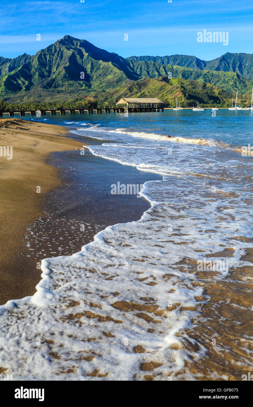 Hanalei Bay on Kauai, with the Hanalei Pier in the distance Stock Photo