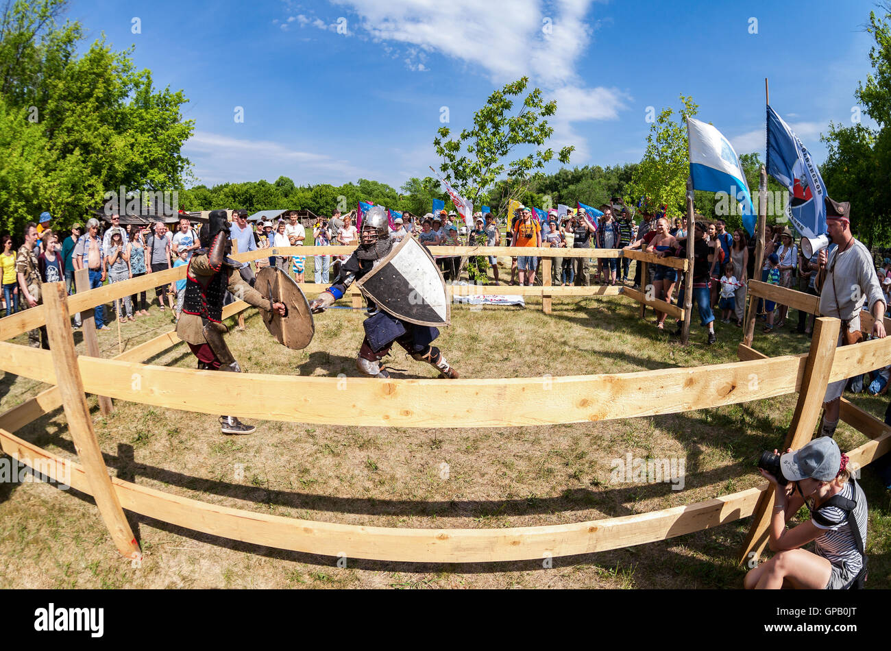 Historical restoration of knightly fights on free festival of medieval culture Stock Photo