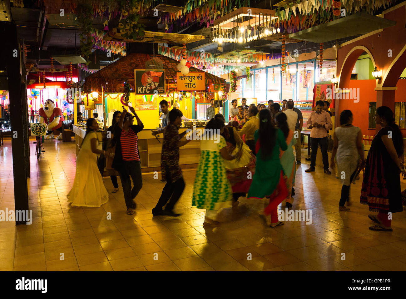 People dancing inside the Village-Soul of India Restaurant Stock Photo