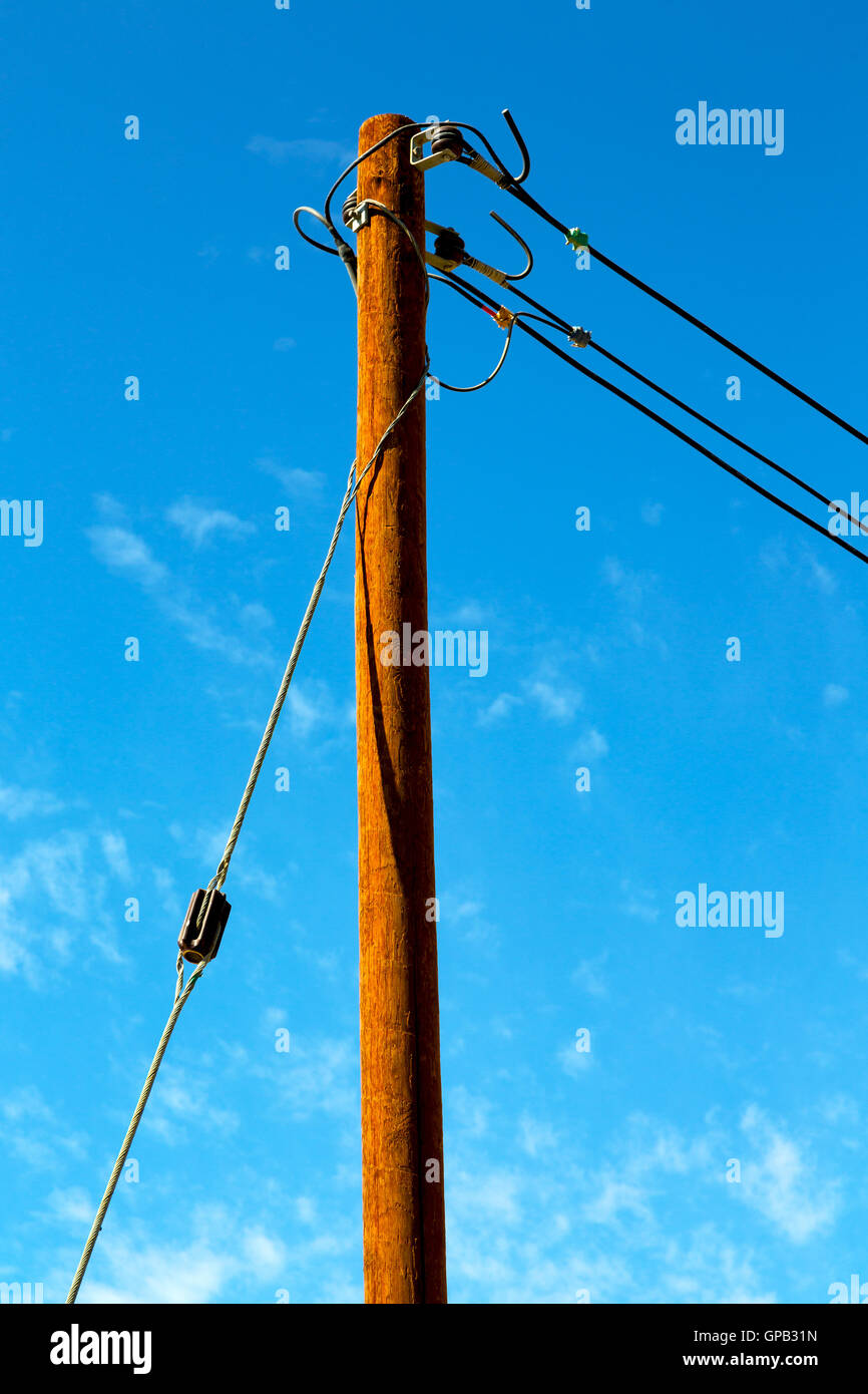 wood pylon energy and current line in oman the electric cable Stock