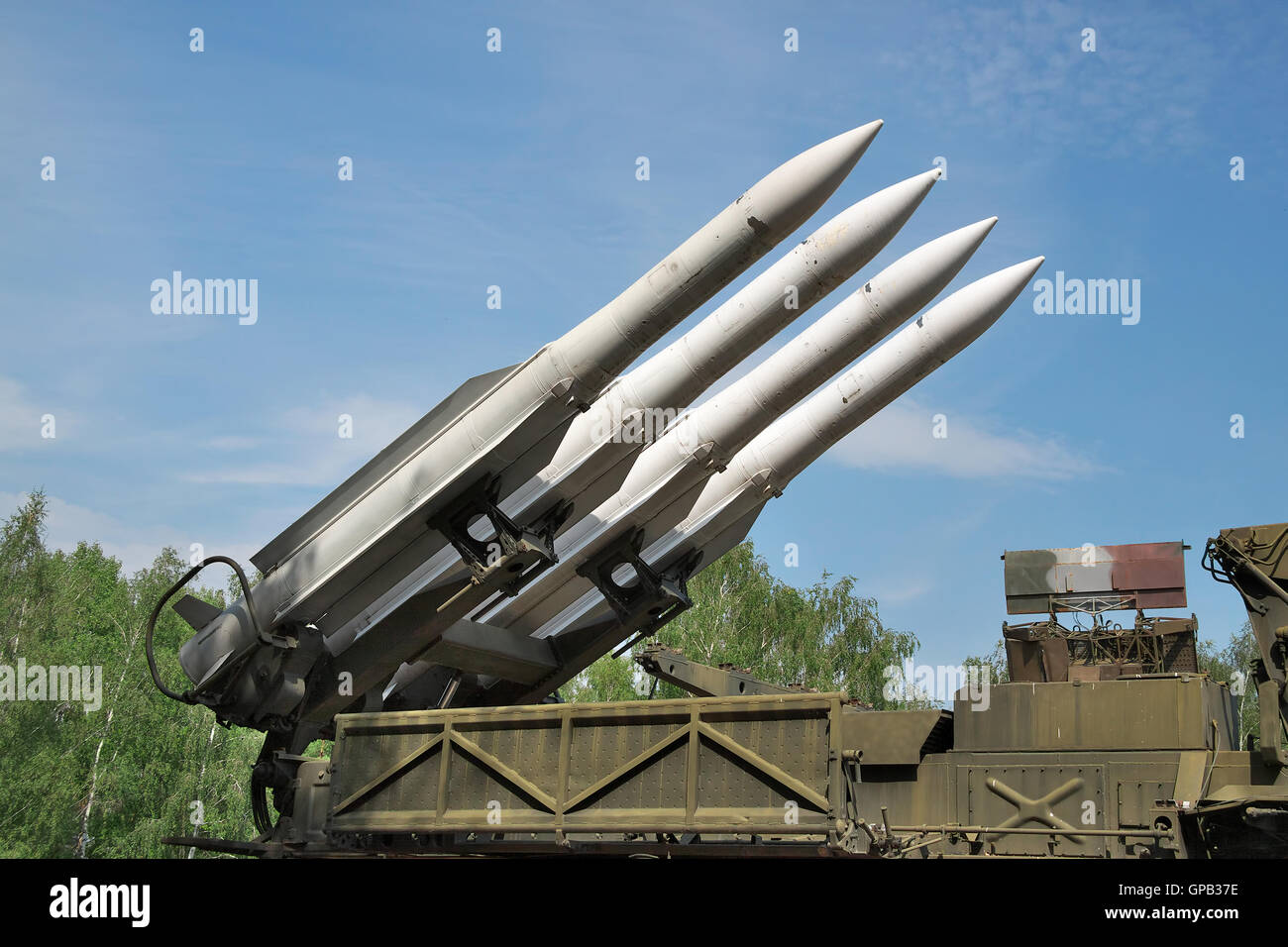 Air defense missiles on position against blue sky Stock Photo