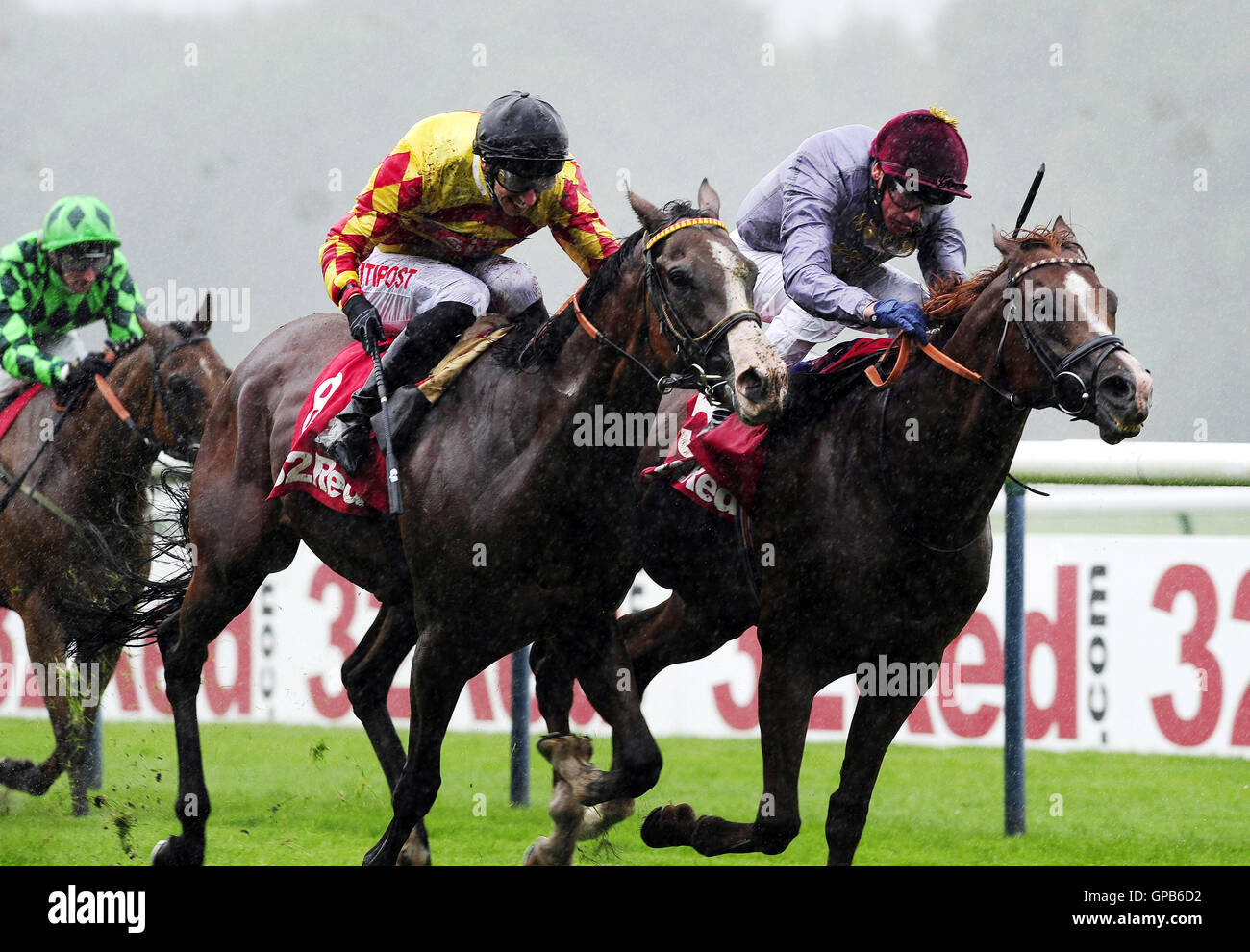Hathal ridden by Frankie Dettori (right) beats Mitchum Swagger ridden by George Baker to win the 32 Red Mile race at Haydock Racecouse. Stock Photo