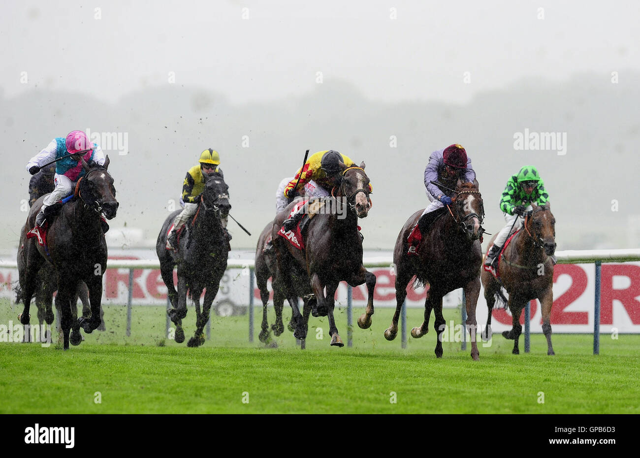 Hathal ridden by Frankie Dettori (second right) beats Mitchum Swagger ridden by George Baker to win the 32 Red Mile race at Haydock Racecouse. Stock Photo
