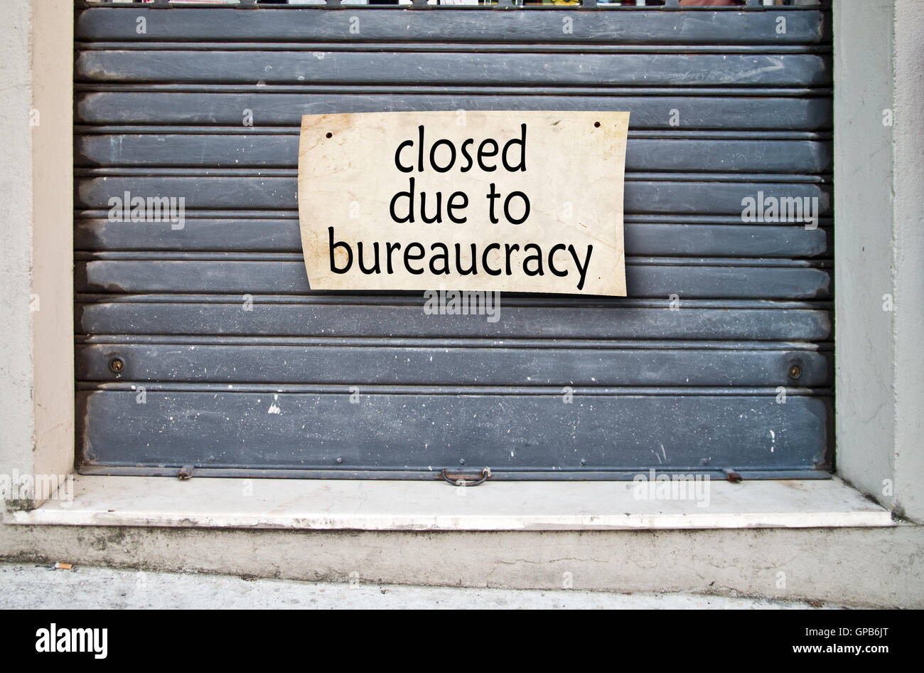 It lowered shutter of a closed company because of the bureaucracy that hinders the free initiative Stock Photo