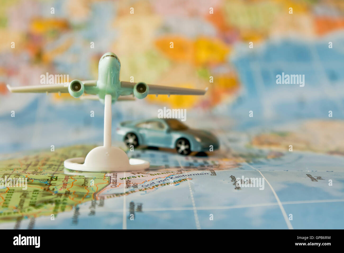 travel concept with  toy car and toy airplane on a map Stock Photo