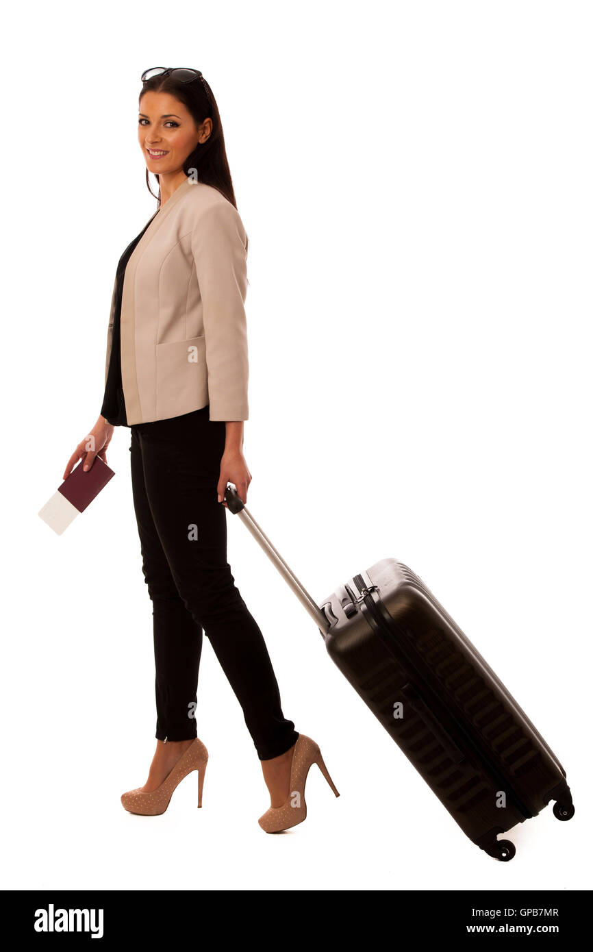 Woman with suitcase going on a business trip. Stock Photo