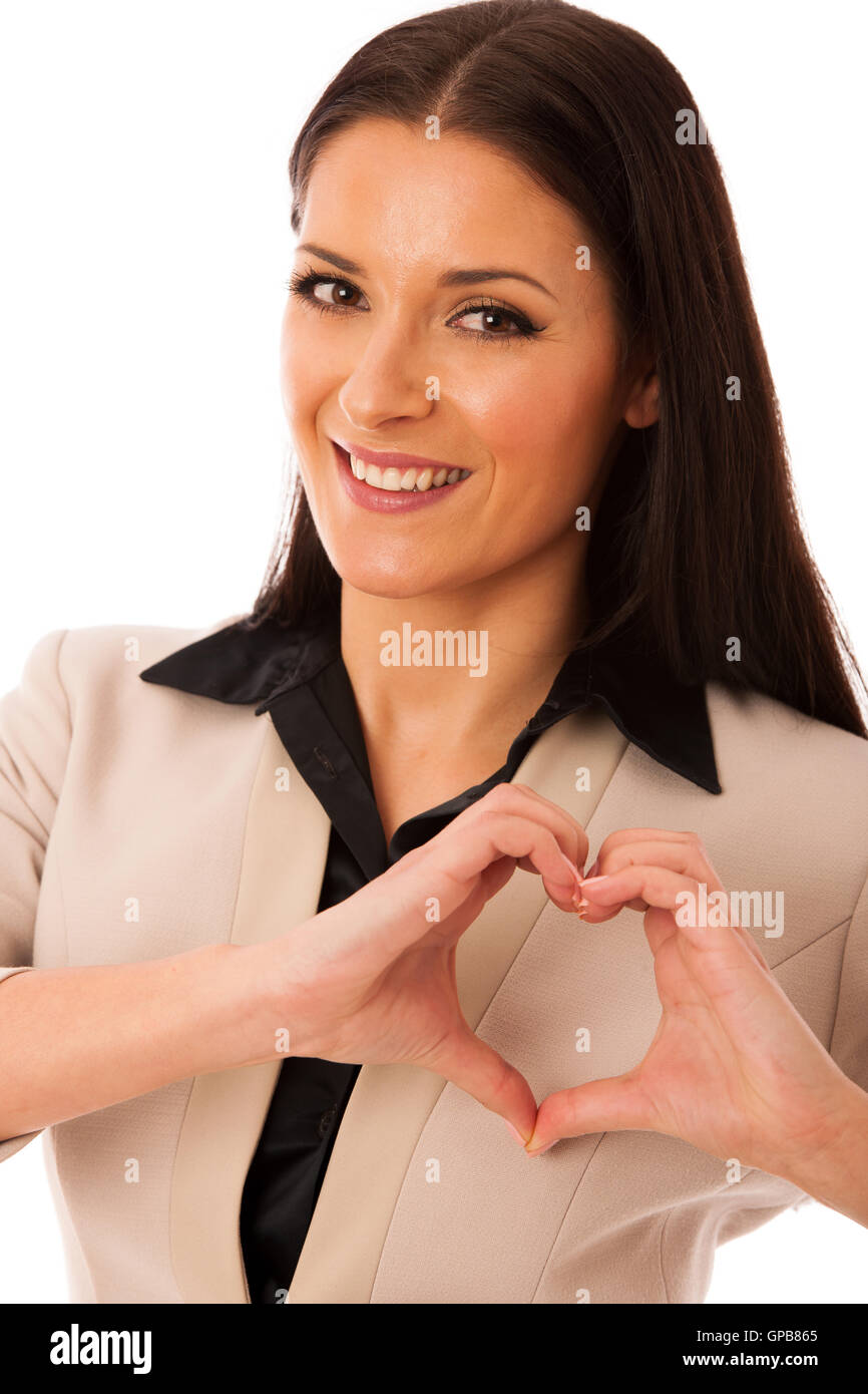 Woman gesturing love and passion with hands in heart shape. Body language of positive emotion. Stock Photo