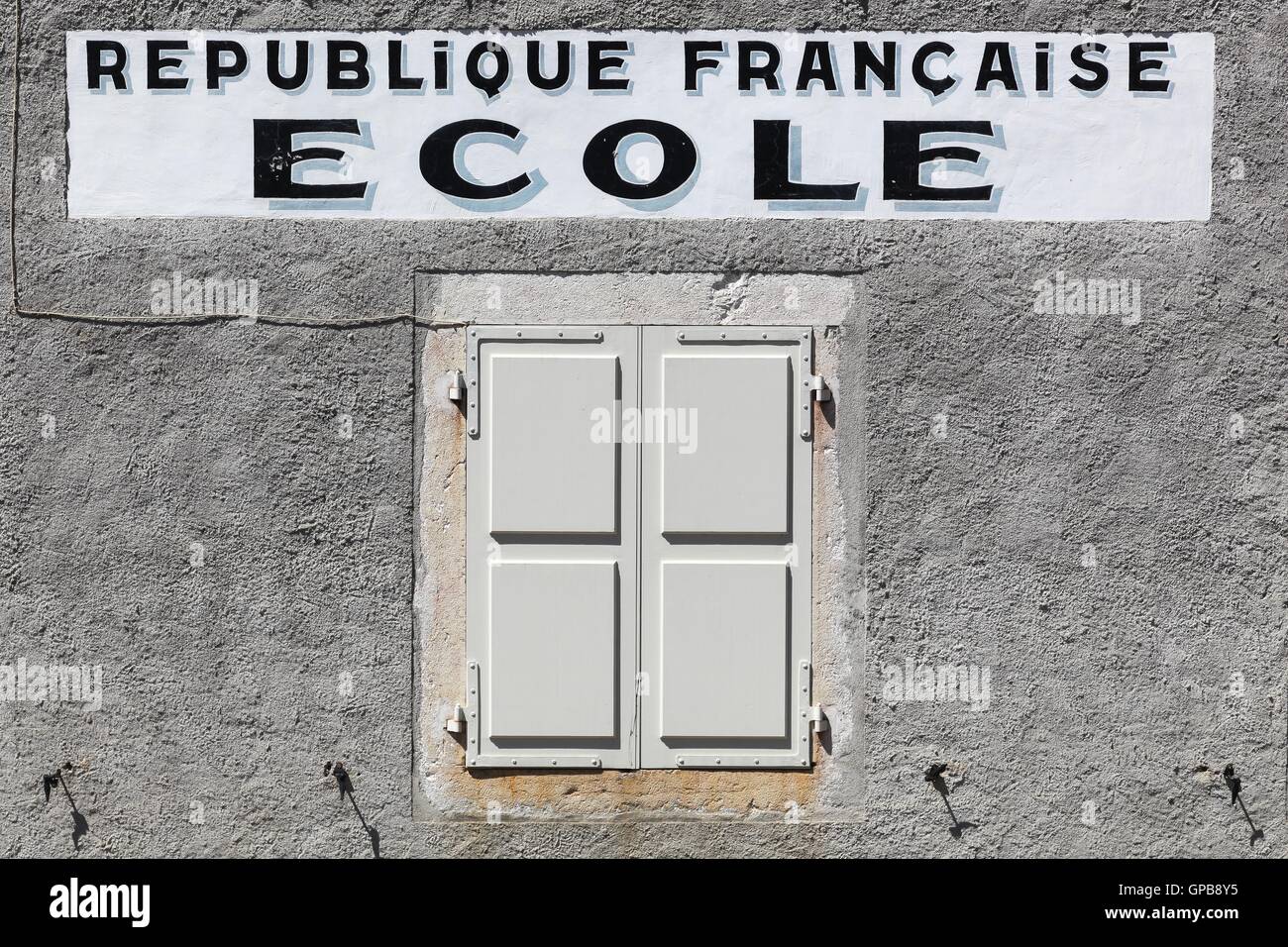 Vintage facade of a school from the French republic Stock Photo