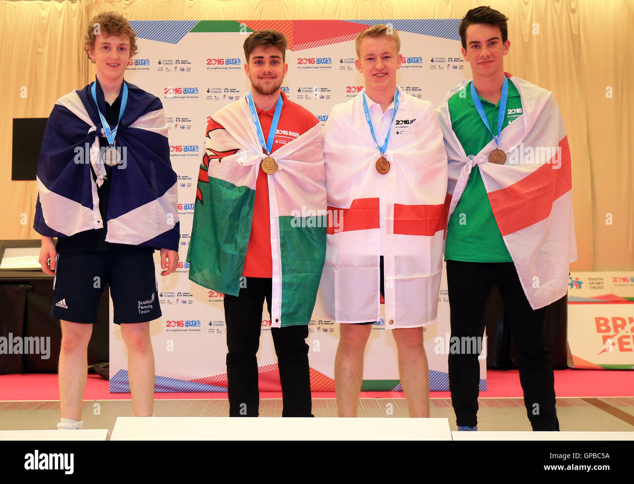 (left to right) Scotland's Christopher Carr (silver) Wales' Jack Cafaro (gold) and Bronze medalists Northern Ireland's Conal Cromie and England Owen Jordan during the medal ceremony for the mens epee on day three of the 2016 School Games at Loughborough University, Loughborough Stock Photo