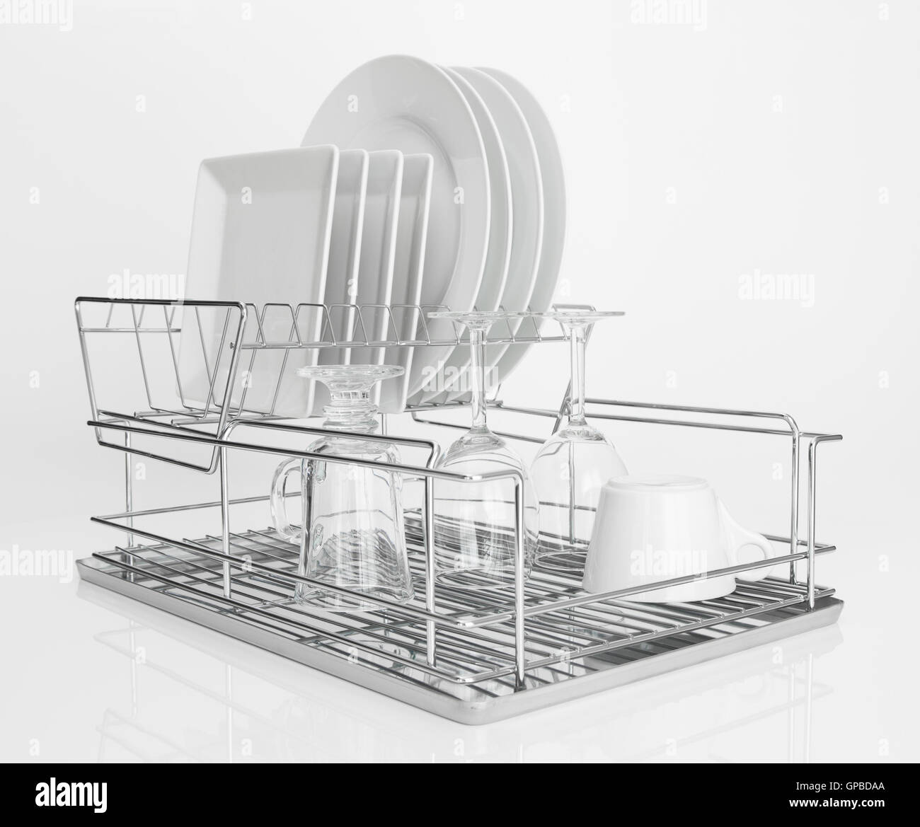 White dishes drying on metal dish rack Stock Photo Alamy