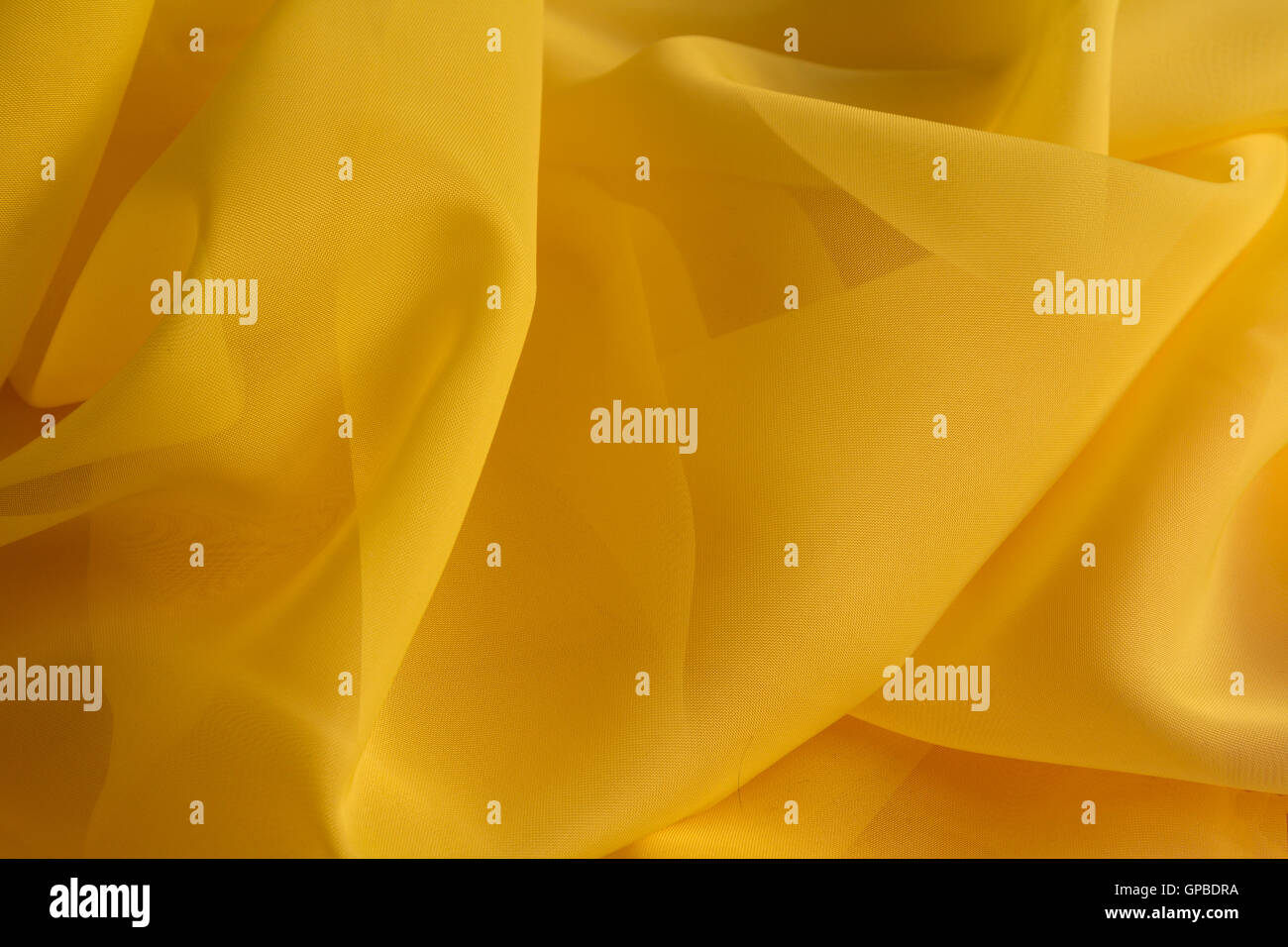 Yellow fabric, backdrop Stock Photo Alamy